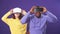 Young interracial couple having first experience of using virtual reality headset