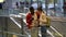 Young interracial couple use smartphone while standing together at airport or railway station