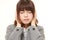 Young Japanese businesswoman suffers from noise