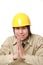 Young Japanese construction worker folding his hands in prayer