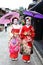 Young Japanese girls dressed in geisha`s custom taking a walk in the stone-paved roads of Ninenzaka and Sannenzaka