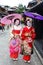 Young Japanese girls dressed in geisha`s custom taking a walk in the stone-paved roads of Ninenzaka and Sannenzaka