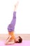 Young Japanese woman doing YOGA shoulder stand