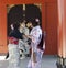 Young Japanese women dressed in Kimonos outside temple