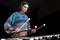 Young jazz musician playing the vibraphone in his private rehearsal room. Black background.