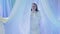 A young Jewish bride is dancing near the chuppah before the wedding