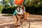 Young and joyful couple learning to ride a bicycle and airship o