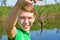 Young joyful guy shows his catch on a fishing trip