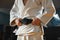 Young judo fighter in kimono posing comfident in the gym, strong and healthy