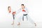 young karate fighters training with red gloves