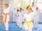 Young karate students gather in dojo