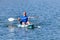 Young Kayaker Paddling Kayak. Sportsman kayaking Blue Water