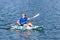 Young Kayaker Paddling Kayak. Sportsman kayaking Blue Water