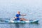 Young Kayaker Paddling Kayak. Sportsman kayaking Blue Water
