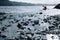 Young kayaker sport woman paddling at Early morning time on a cold lake waves