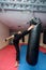 Young kickboxer kicking punching bag in sport gym