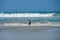 Young kid at the beach enjoying the waves