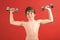 Young kid pumping iron