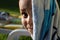 Young kid smiling to the camera after a nice bath in a swimming pool