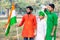 Young kids and boy of different age and different religion hearing tricolor dress and holding Indian National flag.