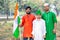 Young kids and boy of different age and different religion hearing tricolor dress and holding Indian National flag.