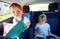 Young kids sitting on back seat, reading book while traveling in the car