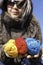 Young knitter with coloured yarns of wool