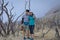 A young korean couple are doing outdoor activities on mountain. Papandayan Mountain is one of the favorite place to hike on Garut