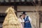 Young Korean couple in hanbok wolking in the park