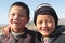 Young kyrgyz brothers looking into the camera, kyrgyzstan, portrait of two friends