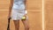 Young lady athlete posing on clay tennis court, perfect fit, fitness model