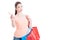 Young lady carrying shopping bags showing refusal or denial gesture