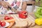 Young lady chopping vegetables