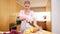 Young lady cutting a pineapple