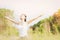 Young lady doing yoga exercise in green field outdoor area showing calm peaceful in meditation mind