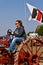 Young lady drives Farmll tractor in a parade