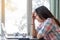 Young  lady feeling tired and stressed. woman working with laptop computer and paperwork.