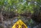 Young lady paddling hard the sea kayak with lots