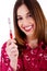 Young lady posing with toothbrush