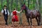 Young lady stroking a horse