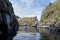 Young lady swimming in outdoor hot water pool during autumn on Iceland