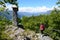 Young lady walks a mountain path to Monte Isola, mountain road landscape, Lombardy, Italy