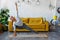 A young Latin American woman does yoga at home. Triangular pose. Athletically built young woman stretches out in the living room