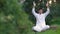 Young latin man sitting in the park and meditating