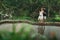 Young latin pregnant woman with husband with amazing view of Ubud rice terraces