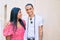 Young latin tourist couple smiling happy at street of city