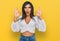 Young latin transsexual transgender woman wearing casual clothes looking surprised and shocked doing ok approval symbol with