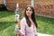 Young latin woman holding a crystal wand in holistic therapy