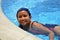 Young latinamerican girl in the swimming pool.