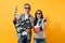 Young laughing couple woman man in 3d glasses watching movie film on date holding classic black film making clapperboard